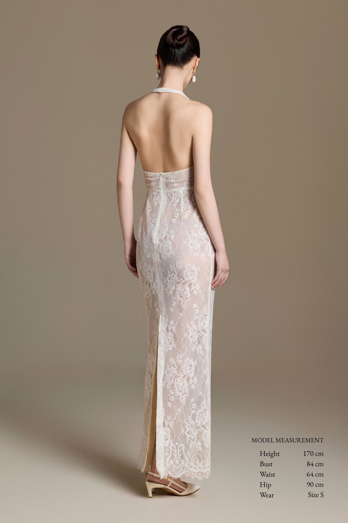 Back view of Paradis Lace Dress with open back and center slit