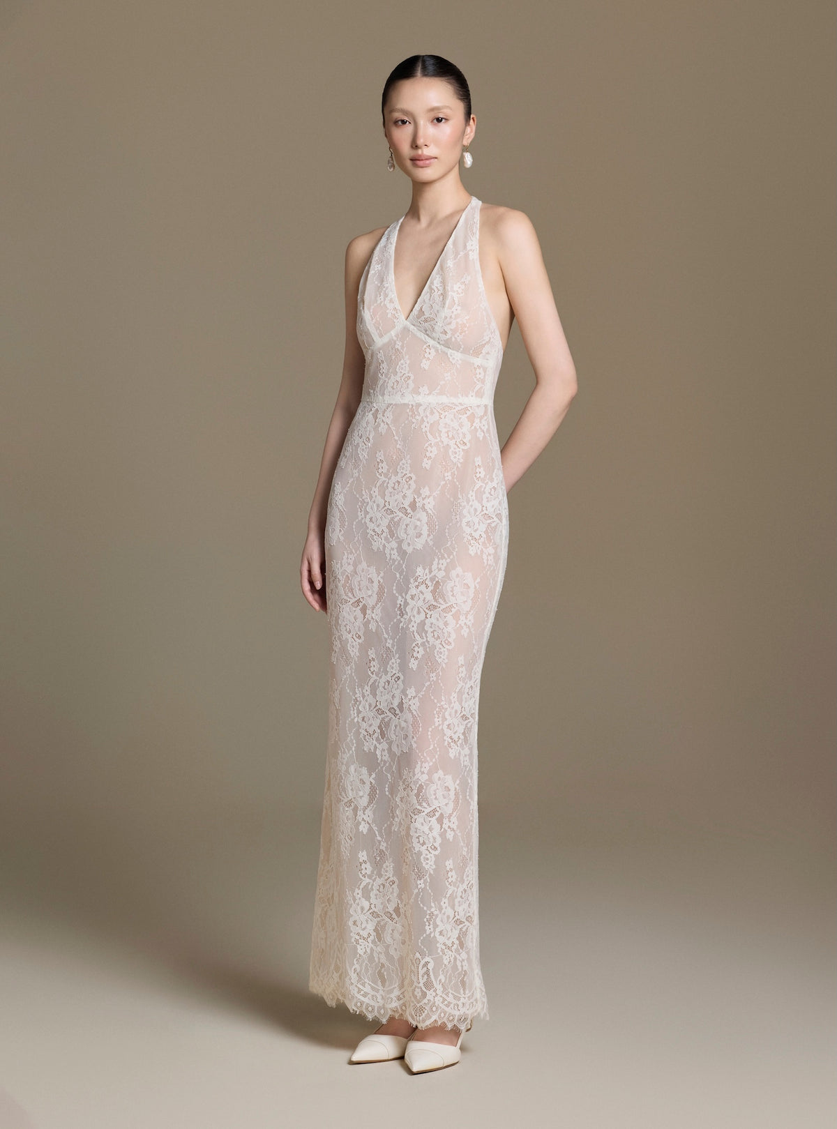 Model wearing the Paradis Lace Dress in white, full front view